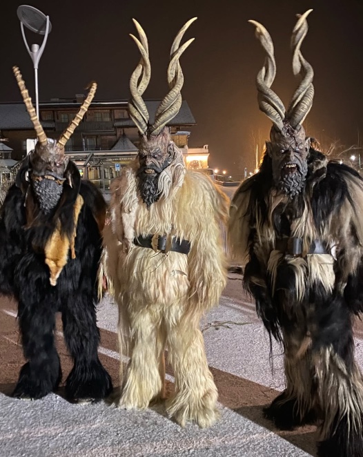 three Krampuses with fur and horns
